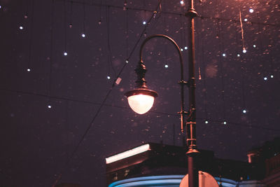 Low angle view of illuminated light bulb