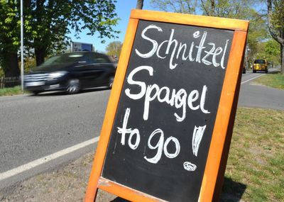 Information sign on road in city