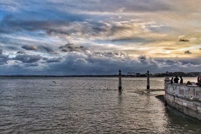 Scenic view of sea against cloudy sky