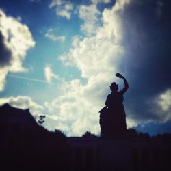 Low angle view of statue against cloudy sky