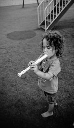 Girl playing with arms raised