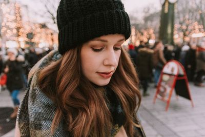 Close-up portrait of young woman in winter