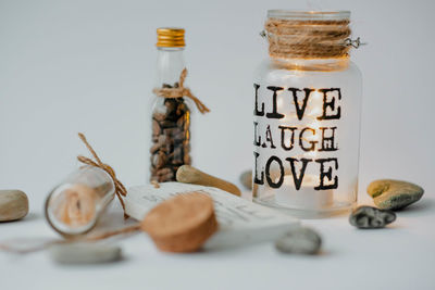 Close-up of glass jar on white background