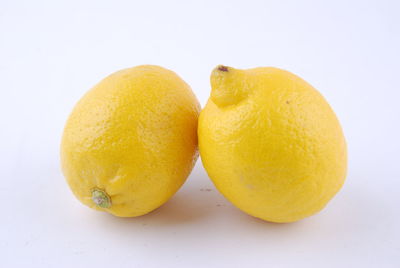 Close-up of oranges against white background