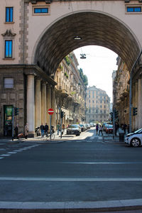 Road amidst buildings in city