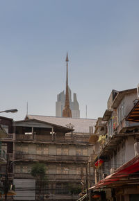 Buildings in city against sky