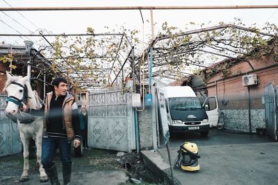 Man standing by bus