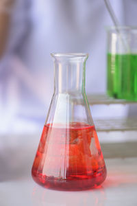 Close-up of chemical in laboratory glassware on table