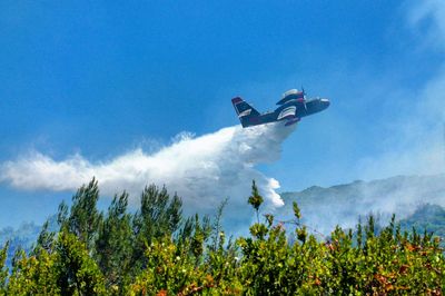 Seaplane discharging water in fire