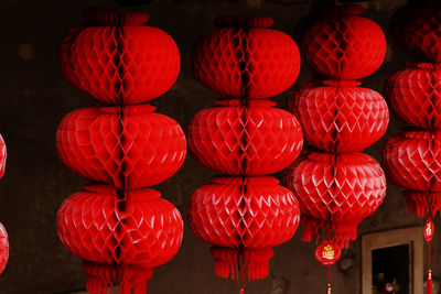 Close-up of illuminated lanterns hanging at night