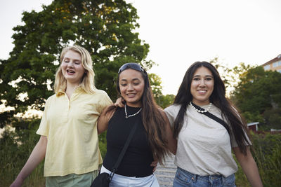 Happy female friends spending time together outdoors