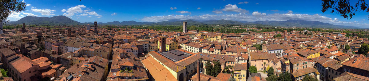 View of cityscape against blue sky