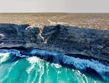 Close-up of wave in sea against sky