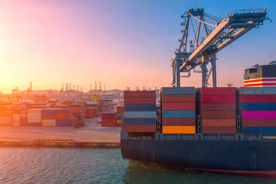 Commercial dock by sea against sky