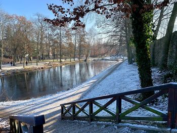 Bridge over river during winter