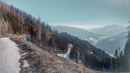 Scenic view of mountains against sky during winter