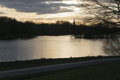 Scenic view of lake against sky during sunset