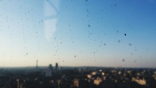 View of cityscape against blue sky