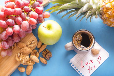 Close-up of fruits and flowers on table