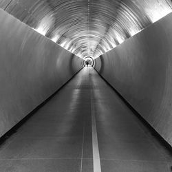 Man in illuminated tunnel