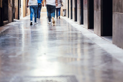 Low section of people walking on walkway