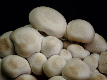 Close-up of eggs against black background