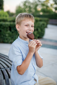 Happy boy holding ice cream