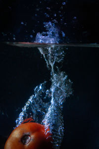 Close-up of hand splashing water