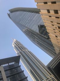 Low angle view of modern buildings against clear sky