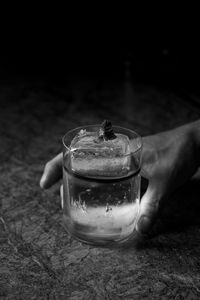 Close-up of hand holding glass of drink