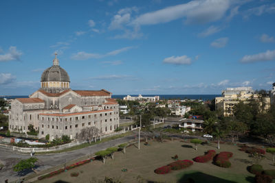 Panoramic view of buildings in city against sky