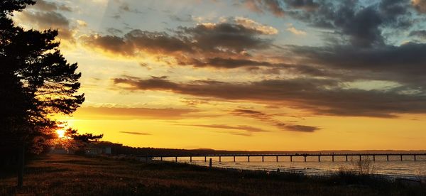 Scenic view of dramatic sky over sea during sunset