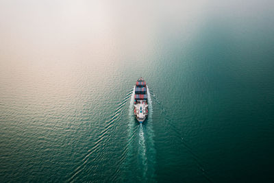 High angle view of ship sailing on sea