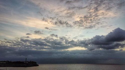 Scenic view of sea against cloudy sky