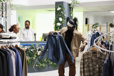 Rear view of woman standing in store