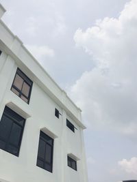 Low angle view of white building against sky