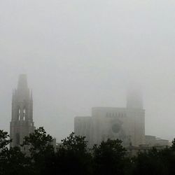 View of city against cloudy sky