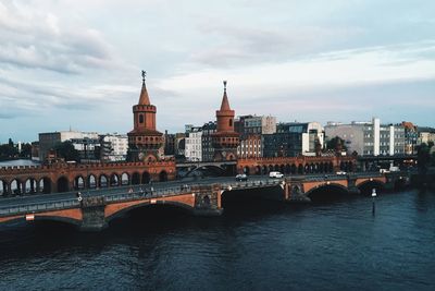 View of bridge over river in city