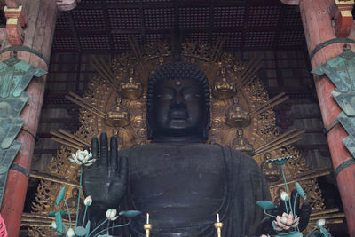 Statue in temple outside building