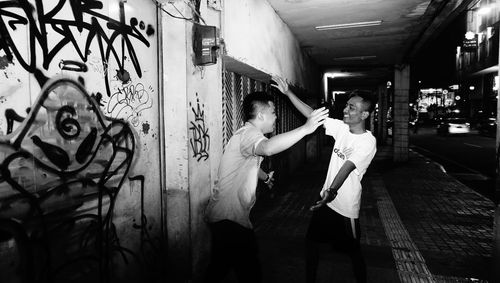 People standing in corridor of building