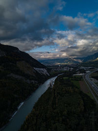 Road by mountain against sky