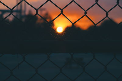 Chainlink fence seen through chainlink fence