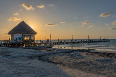 Unidentified people at sunset on the beach of holbox island, mexico