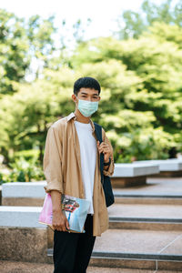 Portrait of young man standing outdoors