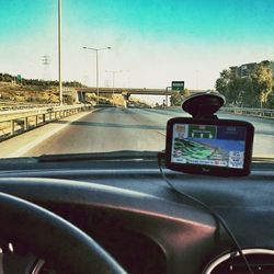 Road seen through car windshield