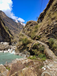 Scenic view of mountains against blue sky