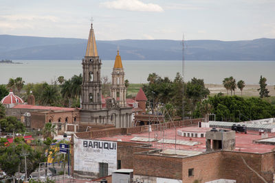 Calm sea with mountain range in background