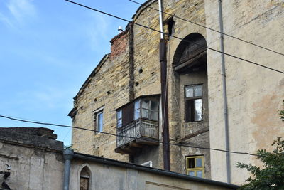 Low angle view of old building against sky