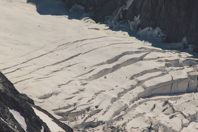 High angle view of glacier amidst rock formations