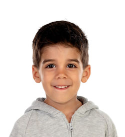 Portrait of smiling boy against white background